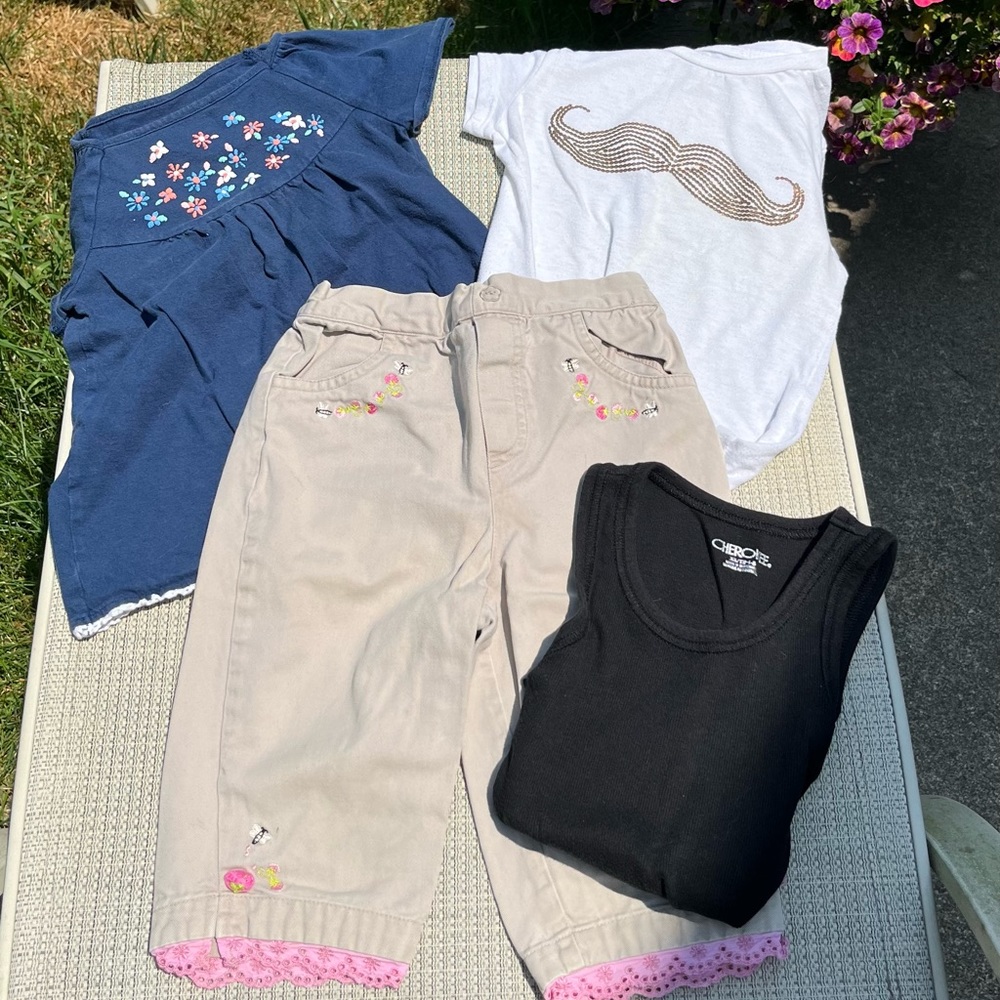 Set of 4 items for your little girl that wears 4t 4/5. Cute khaki pants, 3 tops.